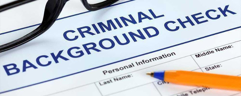 Criminal Background Check form with pen