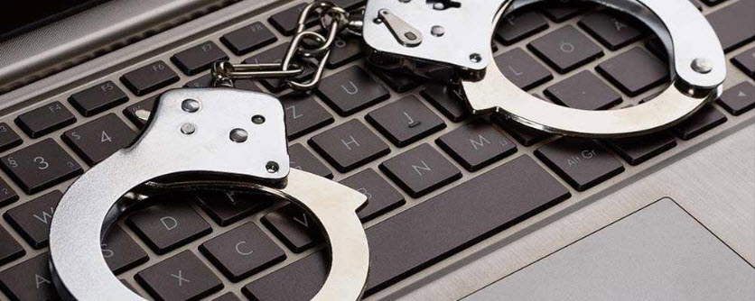 handcuffs on keyboard