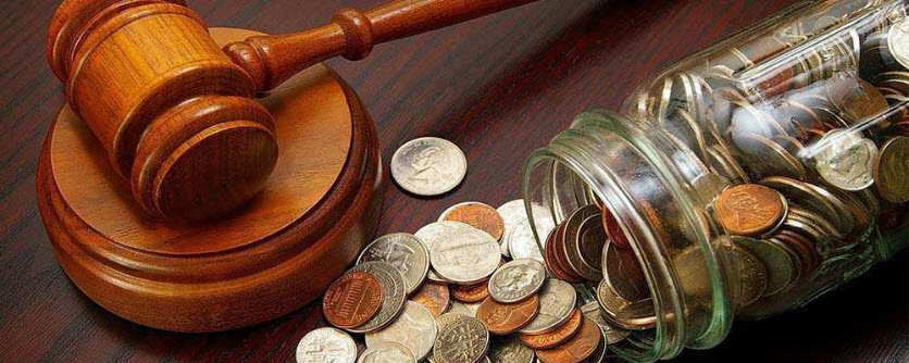 gavel with jar full of coin money