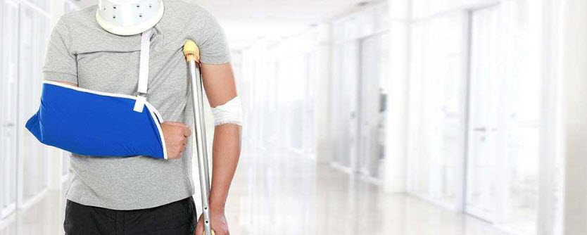 man with broken arm and walk with a crutch