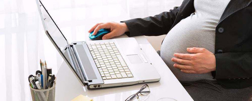 pregnant woman working on laptop