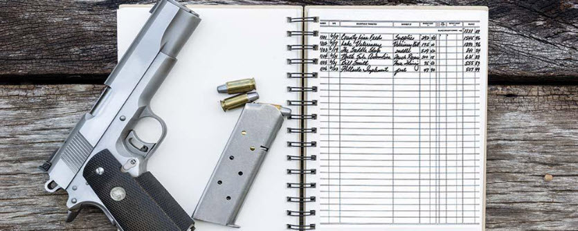 Notebook with gun and bullets