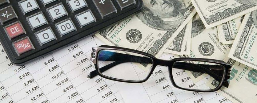 Money spreadsheet calculator and glasses