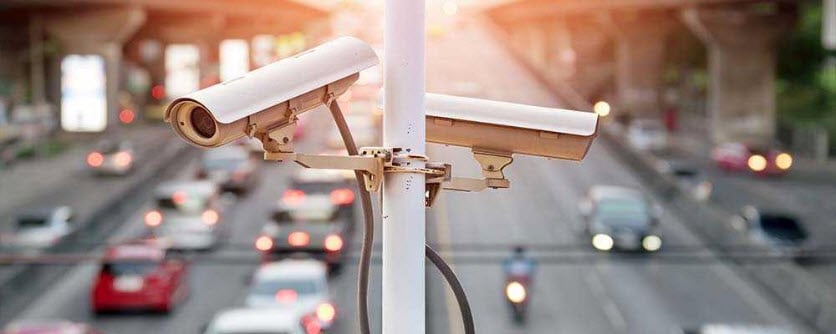 Traffic cameras with highway in background